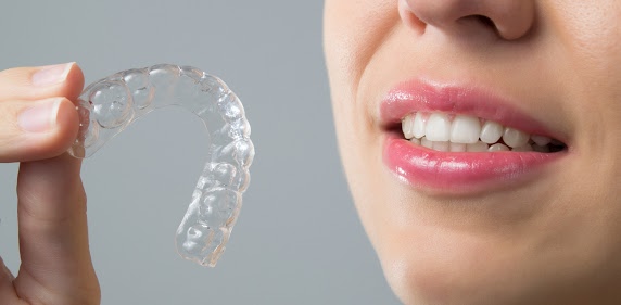This is the image for the news article titled How To Clean Invisalign Aligners